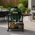 Outdoor grill table cart with dark metal frame, green egg grill, hooks, and shelves.