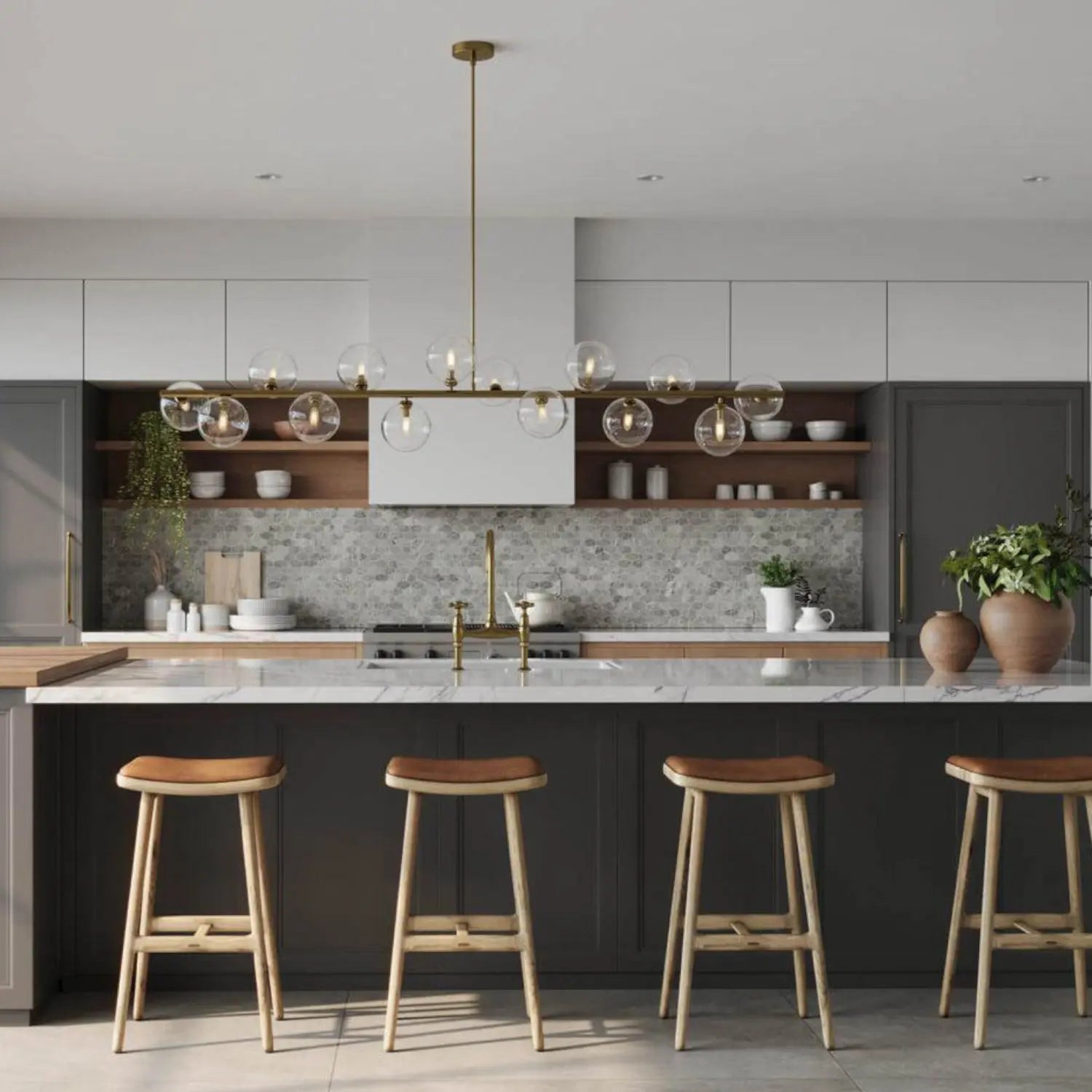 Modern kitchen with marble island, bar stools, and pendant light.